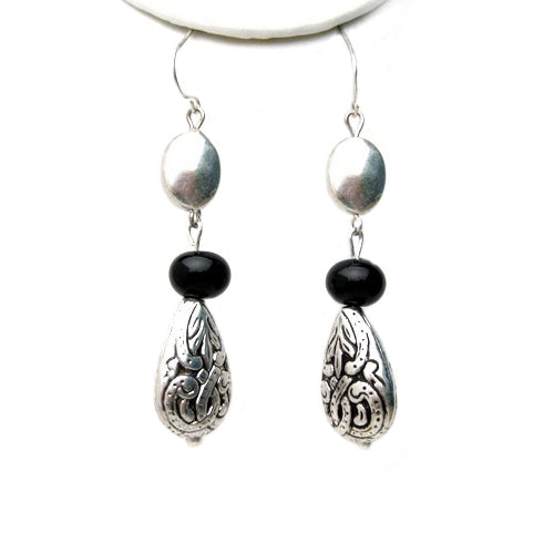 Three different beads dangle from fish hook earrings. Antique silver finish engraved pear shape beads on the bottom connected to glassy black beads, which silver faceted flat bead on top of it. Matching necklace is available both in long charm and short w