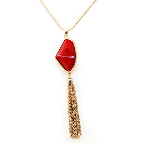 Long gold chain necklace with red stone and gold tassle
