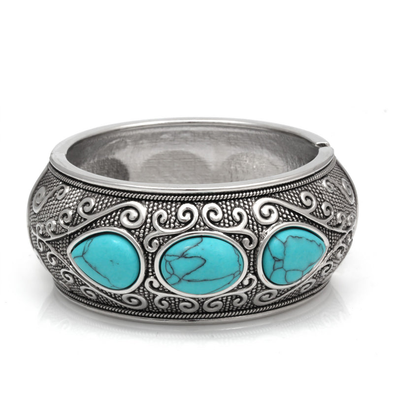 This Bracelet Features Pear Shape Turquoise Stones As Its Center. This Hinged Bracelet Is In Oxidized Silver Finish That Creates Vintage Look.