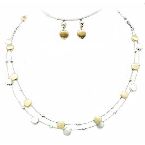 Sleek metal bubbles make lovely stations on this necklace. Give delicate beauty to your look!