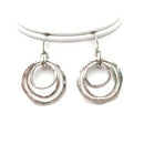 Try our geometric circle earrings. Three different size silver circles dangle from fish hook earrings, and create urban and intelligent look. Wear this metal earrings with matching necklace which is available in two different options.