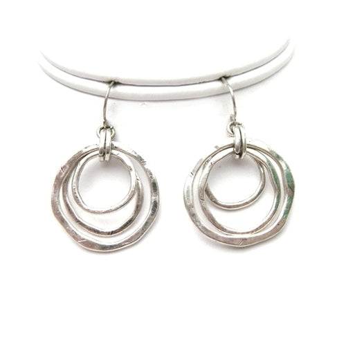 Try our geometric circle earrings. Three different size silver circles dangle from fish hook earrings, and create urban and intelligent look. Wear this metal earrings with matching necklace which is available in two different options.